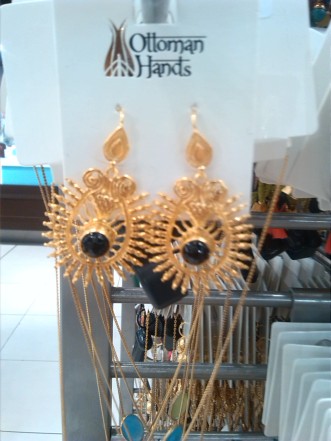 alt=<black and gold earrings>